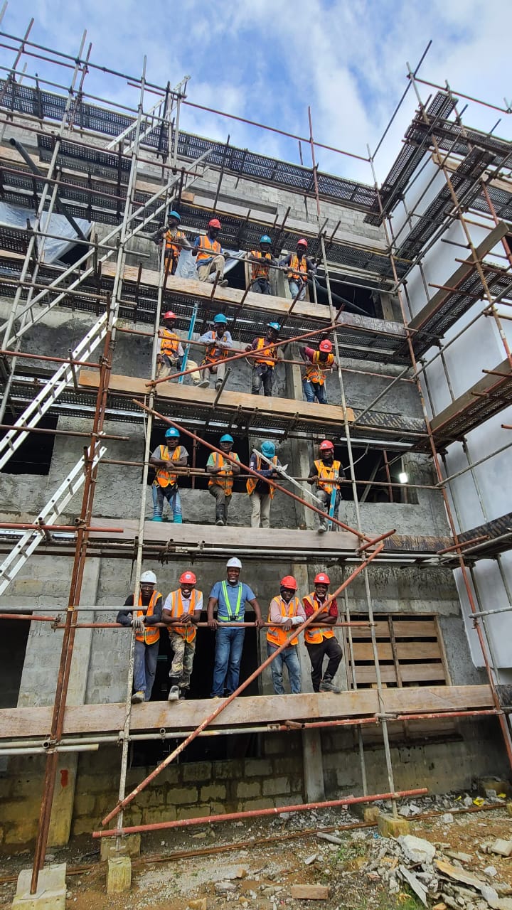 Vibrant Builders construction team on scaffolding